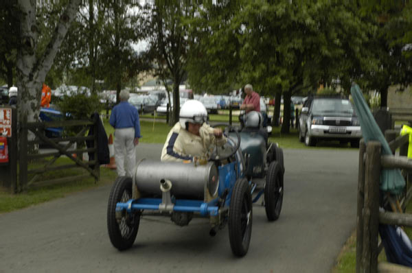 Prescott Hill 168 Bugatti Brescia competitor is pumping his petroltank